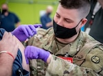 Members of the West Virginia National Guard helped conduct a COVID-19 vaccination clinic at the Toyota Motor Manufacturing plant in Buffalo, West Virginia, March 26, 2021. More than 200 employees were vaccinated, demonstrating a whole of government public-private partnership that has helped West Virginia become a nationally recognized leader in COVID-19 vaccine administration.