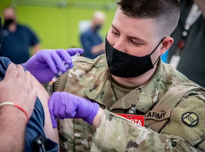 Members of the West Virginia National Guard helped conduct a COVID-19 vaccination clinic at the Toyota Motor Manufacturing plant in Buffalo, West Virginia, March 26, 2021. More than 200 employees were vaccinated, demonstrating a whole of government public-private partnership that has helped West Virginia become a nationally recognized leader in COVID-19 vaccine administration.