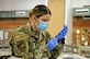 First Lt. Caleena Longworth, a 152nd Medical Group medical service corps officer assigned to Joint Task Force 17, prepares a syringe with the coronavirus vaccine at the Las Vegas Readiness Center, Jan. 27, 2021, in Las Vegas. (Air National Guard photo by Staff Sgt. Matthew Greiner)