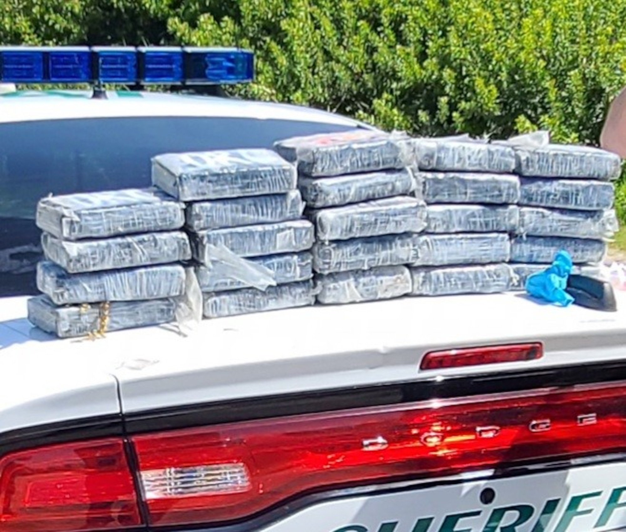 Defenders from the 45th Security Forces Squadron seize nearly 30 kilograms of cocaine that washed ashore on a Cape Canaveral Space Force Station, Florida, beach, May 19, 2021. According to the Brevard County Sheriff's Office, the drugs had an estimated value of approximately $1.2 million.