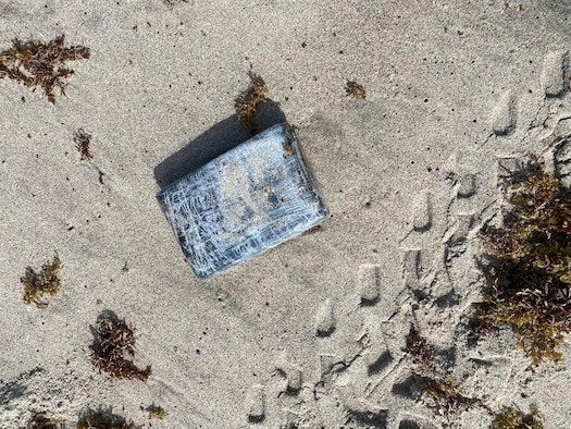 Defenders from the 45th Security Forces Squadron seize nearly 30 kilograms of cocaine that washed ashore on a Cape Canaveral Space Force Station, Florida, beach, May 19, 2021. According to the Brevard County Sheriff's Office, the drugs had an estimated value of approximately $1.2 million.