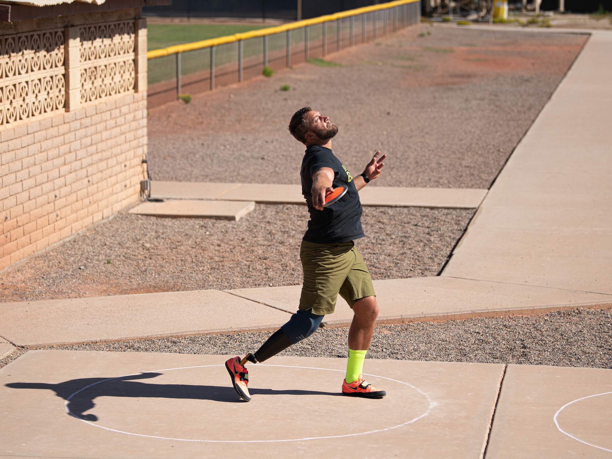 Retired U.S. Navy Petty Officer Third Class Max Rhome throws a discus May 27, 2021, at Luke Air Force Base, Arizona.