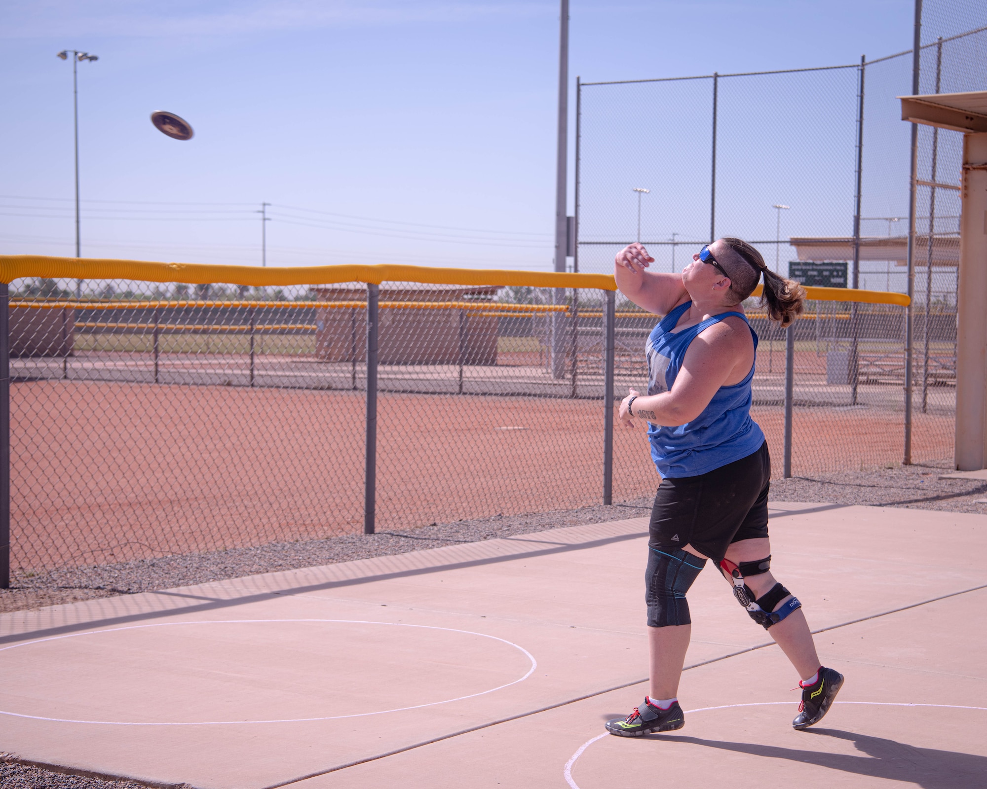 Retired U.S. Marine Staff Sgt. Beth Grauer throws a discus during the Desert Challenge Track and Field Training Camp May 25, 2021, at Luke Air Force Base, Arizona.