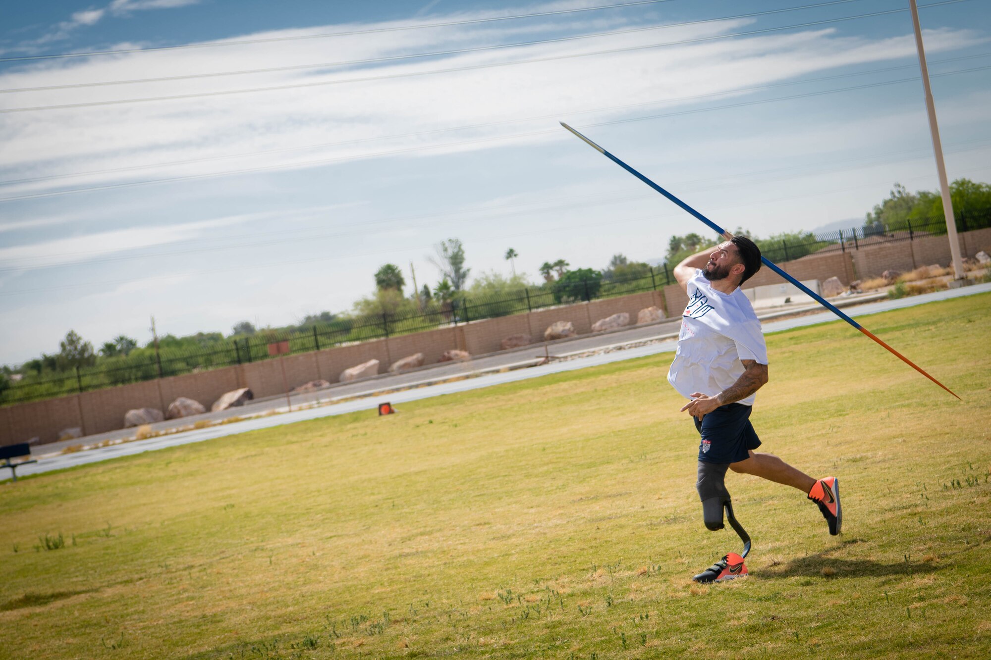 Retired U.S. Army Sgt. Michael Gallardo throws a javelin during the Desert Challenge Track and Field Training Camp May 26, 2021, at Luke Air Force Base, Arizona.