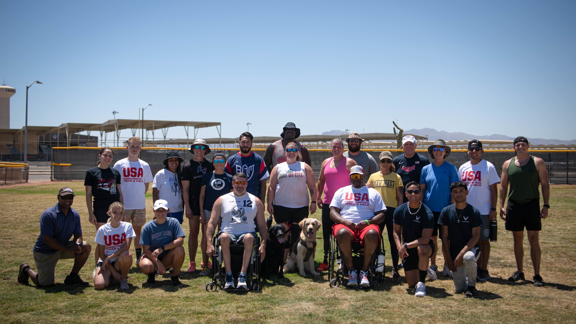 Participants, trainers and coaches of the annual paralympic Desert Challenge Track and Field Training Camp pose for a group photo May 27, 2021, at Luke Air Force Base, Arizona.