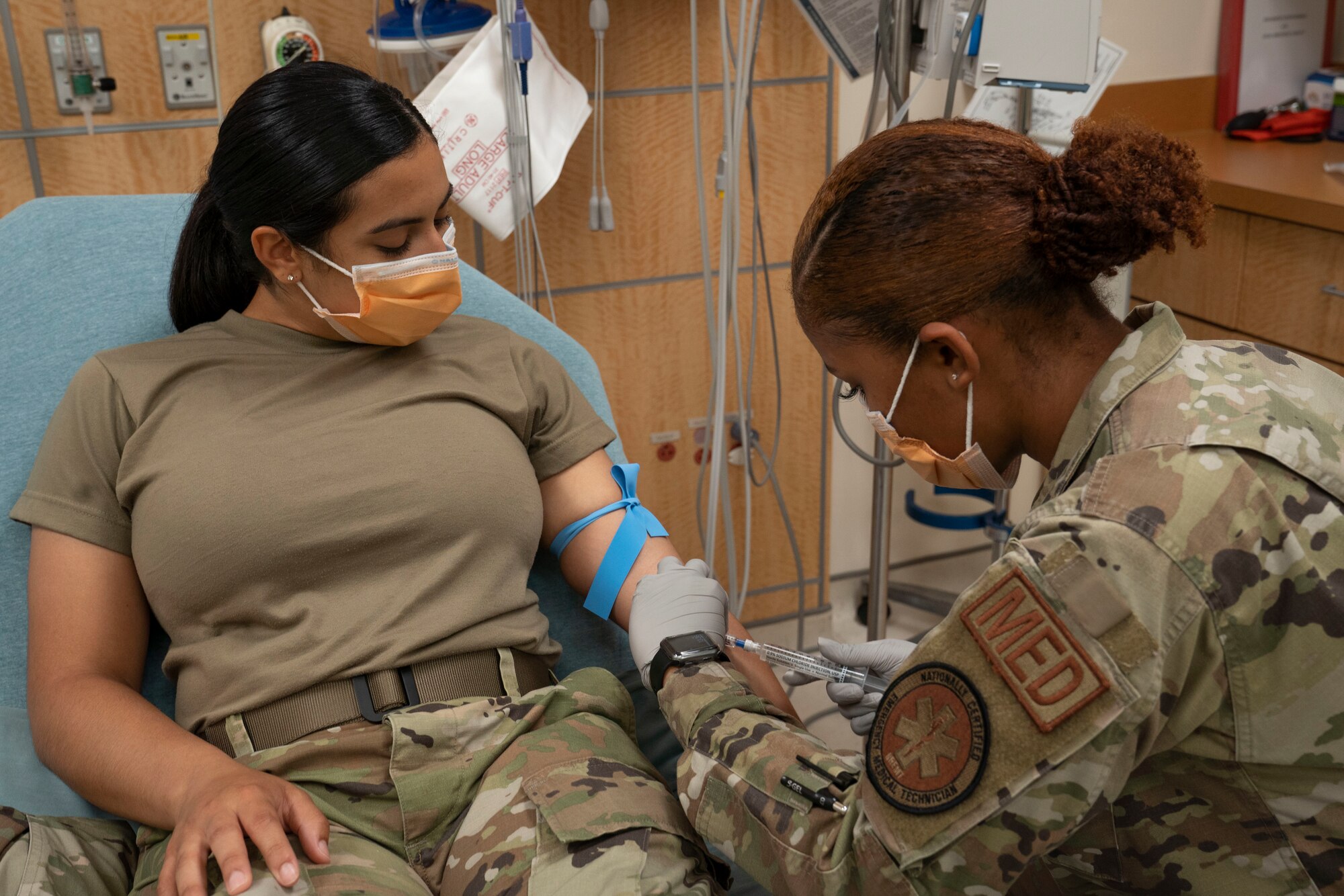 U.S. Air Force Airman 1st Class Alexandria Smith, 81st Healthcare Operations Squadron medical technician, inserts an IV at the Keesler Medical Center on Keesler Air Force Base, Mississippi, June 9, 2021. Smith aims to become a registered nurse, like her mother and grandmother, by commissioning to become an officer. (U.S. Air Force photo by Senior Airman Kimberly L. Mueller)