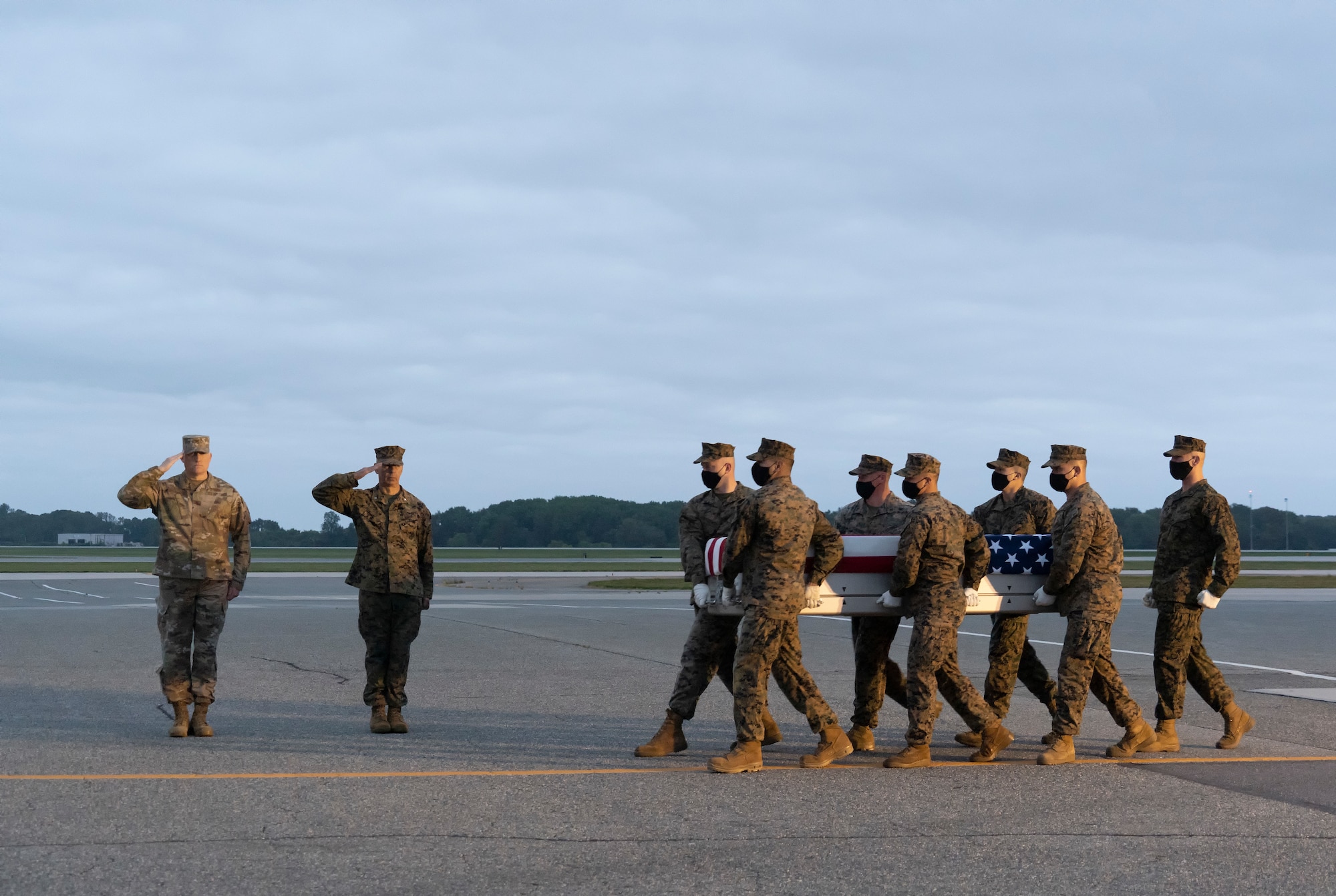 A U.S. Marine Corps carry team transfers the remains of Marine Cpl. Brandon J. Alvarez of Newbury Park, California, June 10, 2021 at Dover Air Force Base, Delaware. Alvarez was assigned to FAST Co., Central Marine Corps Security Force Regiment, Bahrain. (U.S. Air Force photo by Jason Minto)