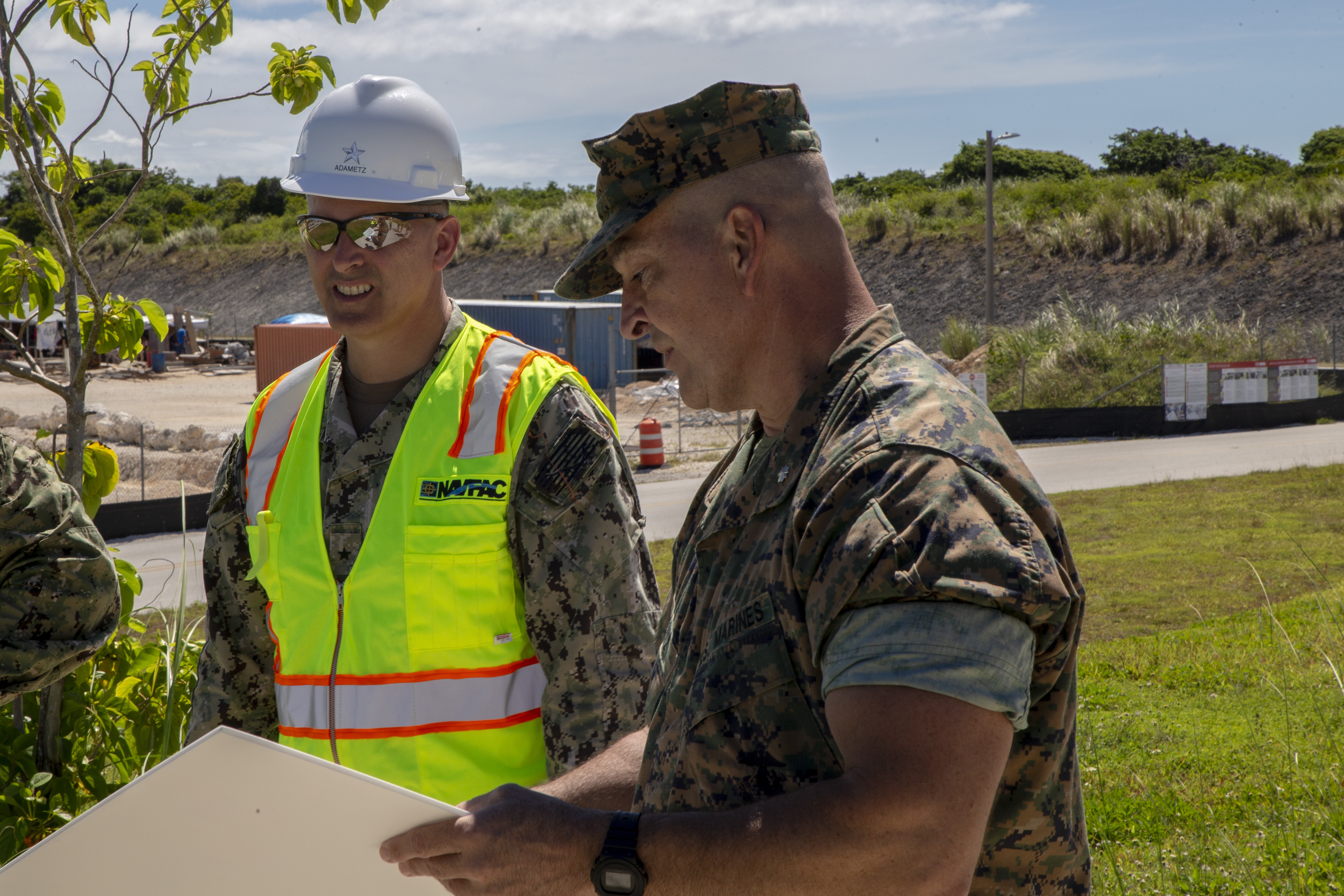 Lt. Col. Tate Buntz, the Marine Corps Base (MCB) Camp Blaz Operations Officer, briefs Rear Adm. John Adametz, the Naval Facilities Engineering Systems Command Pacific Commander, during a visit to MCB Camp Blaz, June 9, 2021.