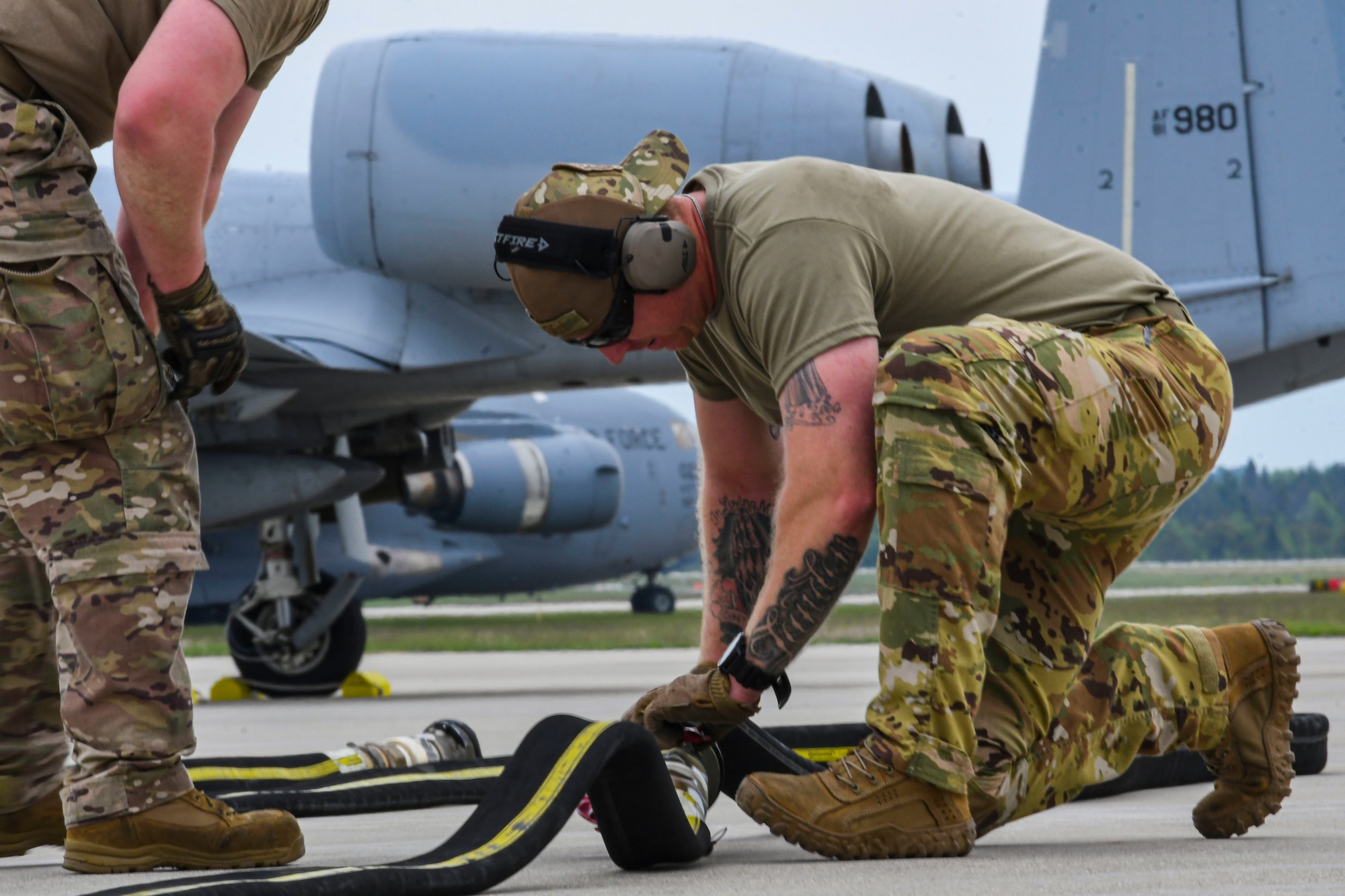 An Airmen from the 19th Airlift Wing prepares a hose for refueling