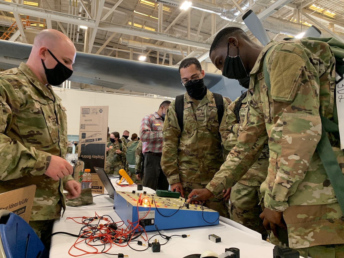 Airmen checking out an electronics display at 37th TRG Showcase.