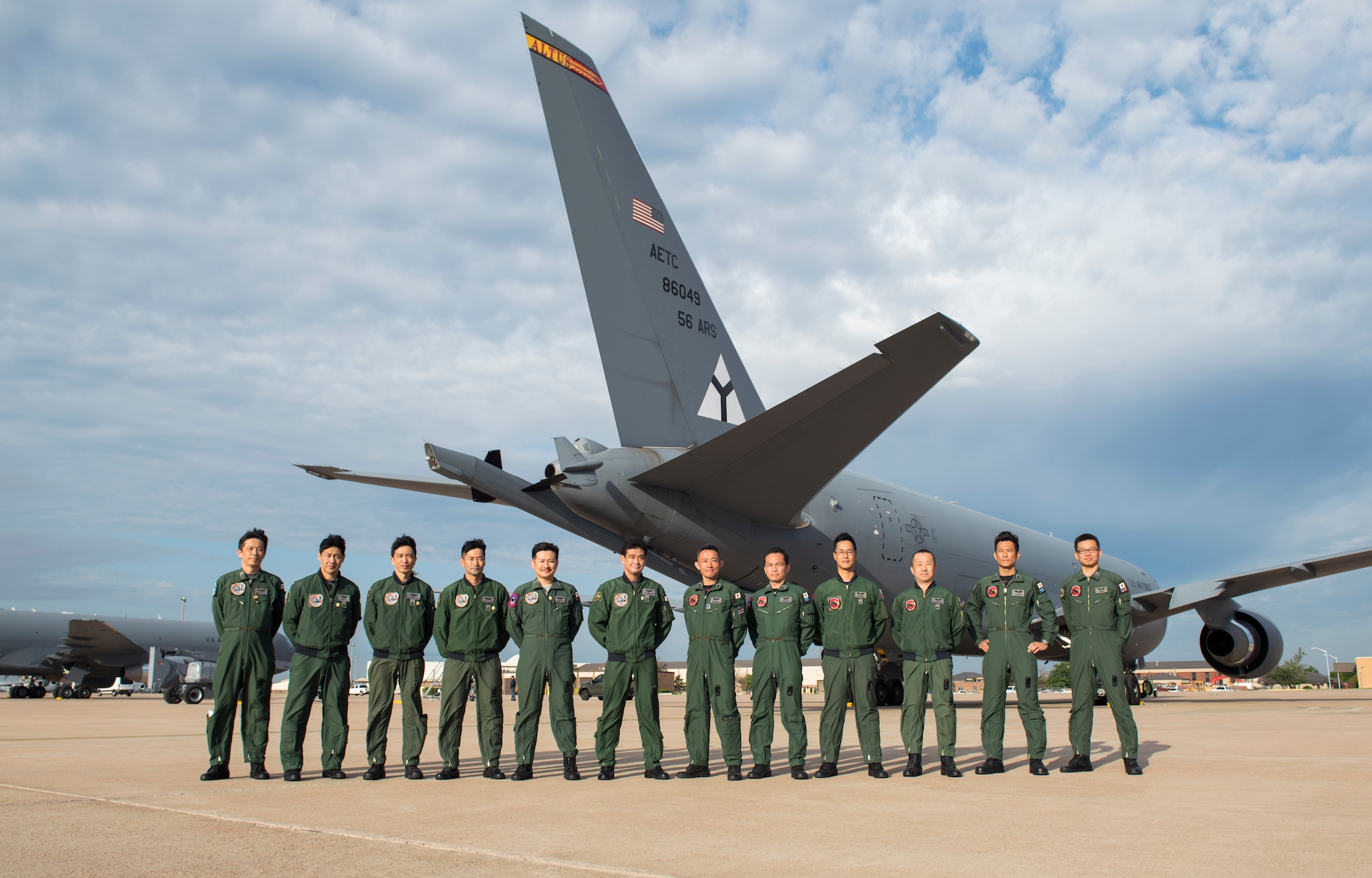 Japanese aircrew students pose for a photo in front of a KC-46 Pegasus, May 12, 2021, at Altus Air Force Base, Oklahoma. The students are Japan Air Self-Defense Force pilots and boom operators who came to Mobility’s Hometown to train on the KC-46. (U.S. Air Force photo by Airman 1st Class Amanda Lovelace)