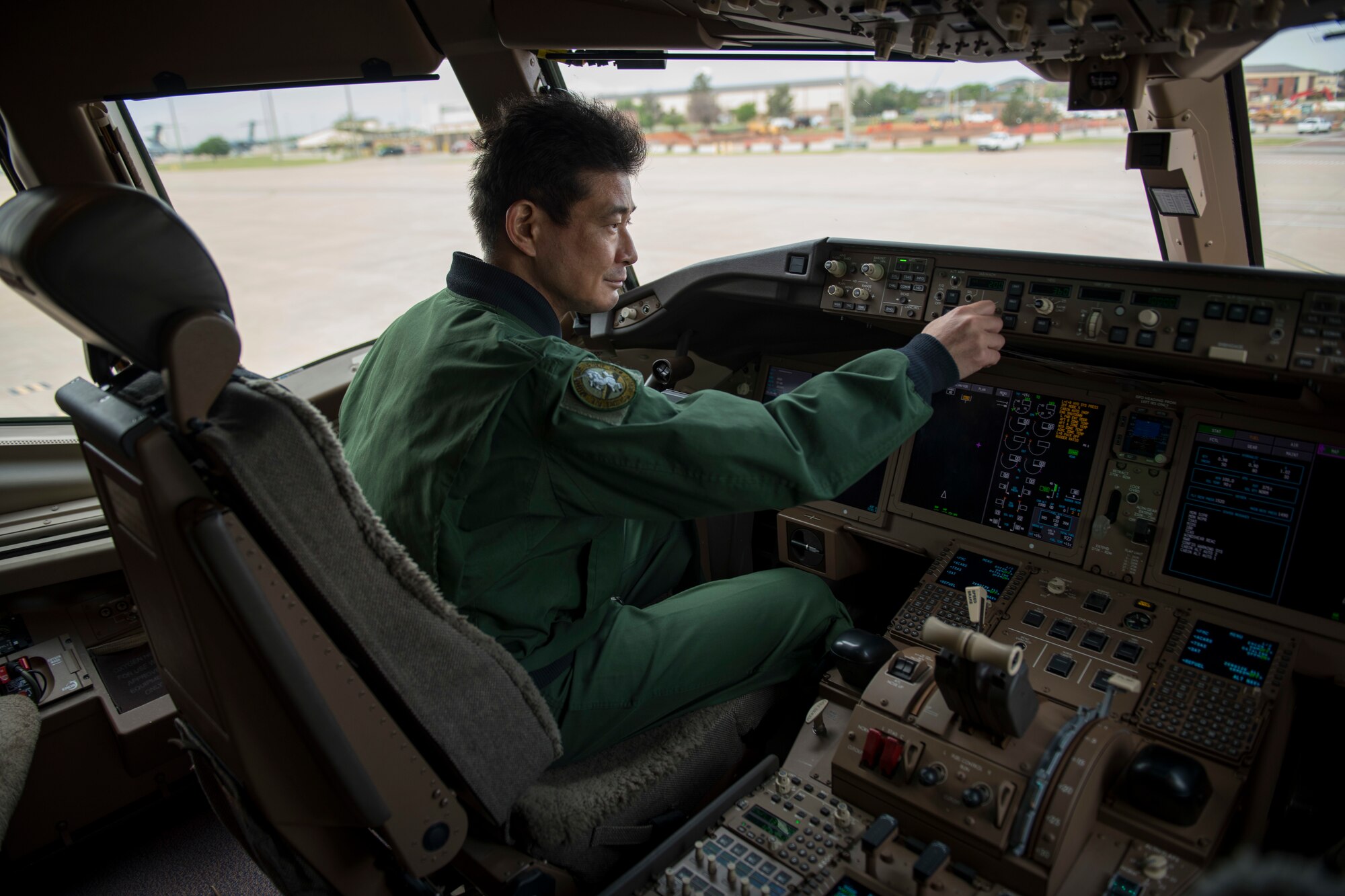 Japan Air Self-Defense Force Lt. Col. Tetsuji Kamiguchi, 405th Air Refueling Squadron commander, sits in the cockpit of a KC-46 Pegasus, May 12, 2021, at Altus Air Force Base, Oklahoma. The KC-46 has the capability to carry more than 212,000 pounds of fuel. (U.S. Air Force photo by Airman 1st Class Amanda Lovelace)