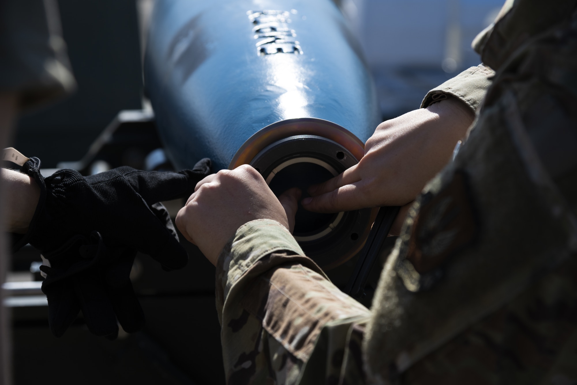 U.S. Air Force Capt. Jacqueline Pippin, 52nd Fighter Wing chaplain, helps assemble a GBU-12 inert bomb used for training at Kallax Air Base, Sweden, June 7, 2021. During training exercises like the Arctic Challenge Exercise 2021, Participation in multinational exercises like Arctic Challenge 21 enhances our professional relationships and improves overall coordination with allies and partner militaries during times of crisis. (U.S. Air Force photo by Senior Airman Ali Stewart)