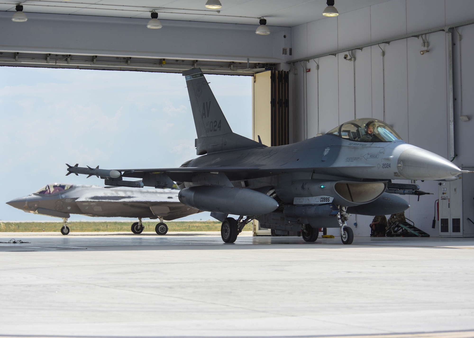 An Italian air force F-35 Lightning II taxis behind a U.S. Air Force F-16 Fighting Falcon assigned to the 555th Fighter Squadron at Amendola Air Base, Italy, June 9, 2021. The aircraft participated in exercise Falcon Strike 21, an Italian air force-led exercise that provides participants the opportunity for developing capabilities in planning and conducting complex air operations in a multinational, joint force environment, leading to an advanced level of training for all participants. (U.S. Air Force photo by Airman 1st Class Brooke Moeder)