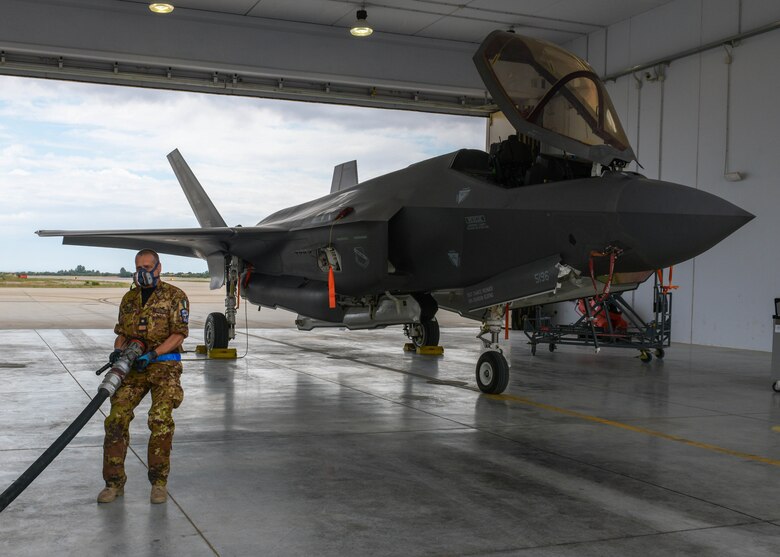 Italian air force Lt. Andrea Ciazza, 13th Group F-35 Lightning II crew chief, prepares to refuel a U.S. Air Force F-35 from the 4th Fighter Squadron, 388th Fighter Wing, during Falcon Strike 21 (FS21) at Amendola Air Base, Italy, June 7, 2021. FS21 is a joint, multinational exercise with participants from the United States working with service members from Israel, Italy, and the United Kingdom that optimizes the integration between fourth-and-fifth-generation aircraft. (U.S. Air Force photo by Airman 1st Class Brooke Moeder)