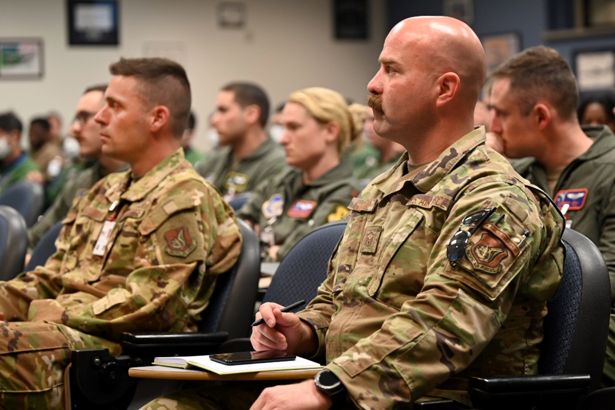 Service members from U.S. Air Force and Japan Self-Air Defense Force listen to the Deployed Forces Commander, Col. Brian Cusson, to kick-off RED FLAG-Alaska 21-2 at Joint Base Elmendorf-Richardson, Alaska, June 10, 2021.