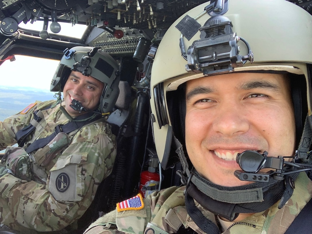 U.S. Army Chief Warrant Officer 3 Mauricio Garcia, right, pilots a 12th Aviation Battalion UH-60M Black Hawk, with his co-pilot, Chief Warrant Officer 3 Kevin Wikstrom. (Courtesy photo)