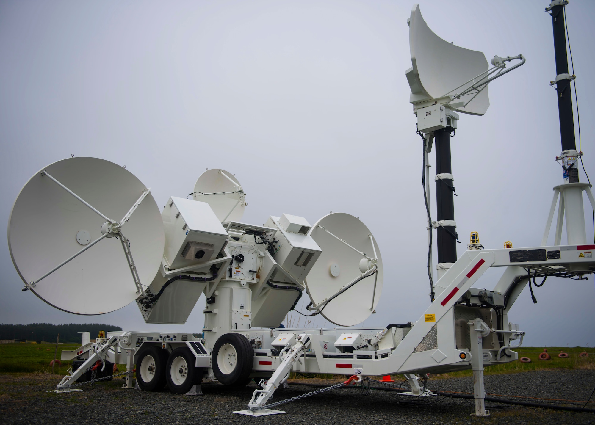 Satellite dishes on a Joint Threat Emitter spin while operated by defense industry partners.