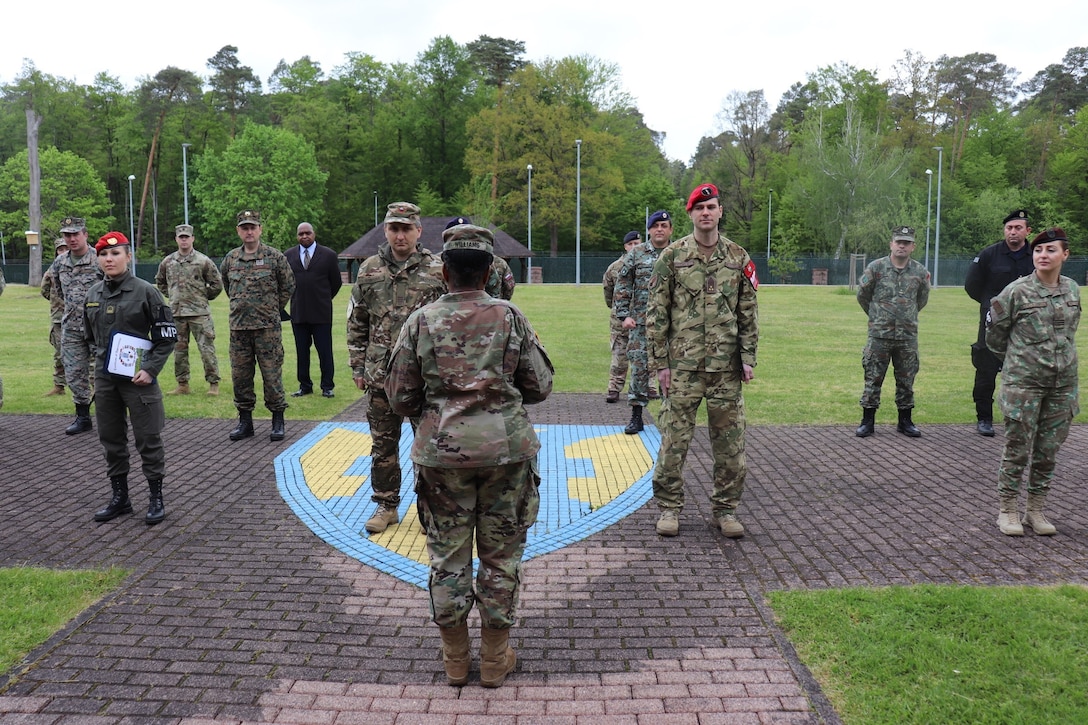 U.S. Army Reserve Brig. Gen. Wanda N. Williams, commanding general of the 7th Mission Support Command and joint security coordinator for the Joint Security Coordination Center, addresses a formation of U.S. Army, NATO Allies, and Partnership for Peace Soldiers on Panzer Kaserne in Kaiserslautern, Germany, May 27, 2021. U.S. Army Reserve Soldiers and Civilians assigned to the 7th MSC teamed up with NATO Allies and partners from 18 different countries to provide a unique protection capability for U.S. Army Europe and Africa by serving as the JSCC in support of DEFENDER Europe 21. (U.S. Army Reserve Photo by Capt. Lorenzo Llorente)