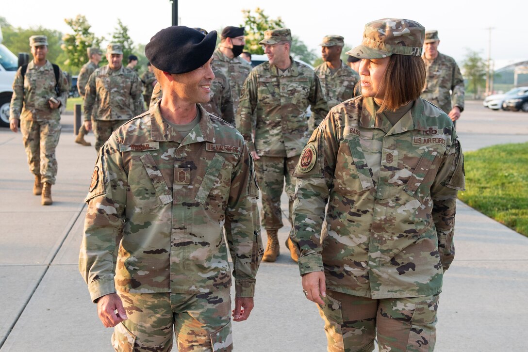 Chief Master Sergeant of the Air Force JoAnne S. Bass, right, talks with Chief Master Sgt. Gary Bubar, 88th Security Forces Squadron superintendent, upon her arrival at the unit June 4, 2021, as part of a three-day tour of Wright-Patterson Air Force Base, Ohio. Bass visited several units within the 88th Air Base Wing, Air Force Materiel Command, Air Force Life Cycle Management Center and Air Force Research Laboratory. (U.S. Air Force photo by Wesley Farnsworth)