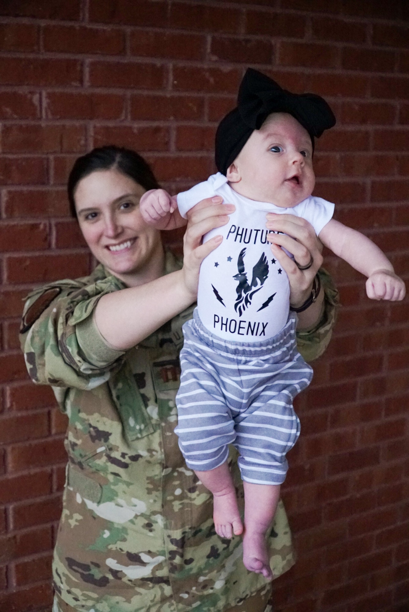 Photo of Airmen with Child