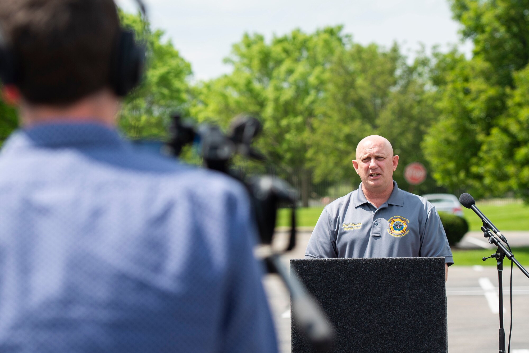 Jeffrey Kitzmiller, 788th Civil Engineer Fire Department assistant chief, briefs members of the 88th Air Base Wing Public Affairs office who are playing the role of local media during a practice press conference that was held as part of a 420,000 gallon fuel spill exercise at Wright-Patterson Air Force Base, Ohio, May 19, 2021. Readiness exercises are routinely held to streamline unit cohesion when responding to emergencies. (U.S. Air Force photo by Wesley Farnsworth)