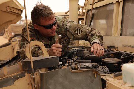 Georgia Army National Guard Spc. Michael Brannon of the 148th Brigade Support Battalion performs maintenance on a Humvee in Tan-Tan, Morocco, June 8, 2021, during the African Lion 21 exercise. More than 7,000 participants from nine nations and NATO train together to enhance readiness.