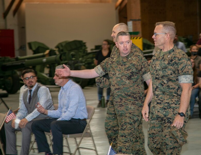 Lieutenant Colonel Micheal Graham, outgoing commanding officer, 1st Force Storage Battalion, welcomes Major General Joseph F. Shrader, commanding general, Marine Corps Logistics Command, and Colonel Craig C. Clemans, commanding officer, Marine Corps Logistics Base Barstow, to the 1st FSB Change of Command ceremony, June 8. The ceremony saw LtCol Graham relinquish command of 1st FSB to LtCol. LaBarron L. McBride.