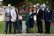 A sculpture bust of retired U.S. Air Force Col. Lawrence Lane, former security forces raven officer, is revealed during a commemoration ceremony for the Air Transportation career field and Lane, on Scott Air Force Base, Illinois, June 08, 2021. Lane enlisted as a jet propulsion specialist commissioned after 10 years of service. (U.S. Air Force Photo by Airman 1st Class Isaac Olivera)