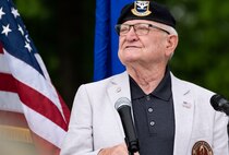 Retired U.S. Air Force Col. Lawrence Lane, former Security Forces raven one officer, speaks during a commemoration ceremony on Scott Air Force Base, Illinois, June 08, 2021. The commemoration ceremony highlighted Lane and the Air Transportation career field for their contributions to Air Mobility.  (U.S. Air Force Photo by Airman 1st Class Isaac Olivera)