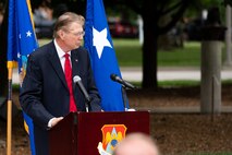 Retired U.S. Air Force Chief Master Sgt. Bill Powell, former air transportation specialist, speaks during a commemoration ceremony for the Air Transportation career field, and retired U.S. Air Force Col. Lawrence Lane, former security forces raven officer, on Scott Air Force Base, Illinois, June 08, 2021. Powell along with others in his career field, developed Intransient Visibility, Transloading Aircraft and the Aerial Port Expeditor Program, improving the efficiency of the Aerial Port Operations. (U.S. Air Force Photo by Airman 1st Class Isaac Olivera)