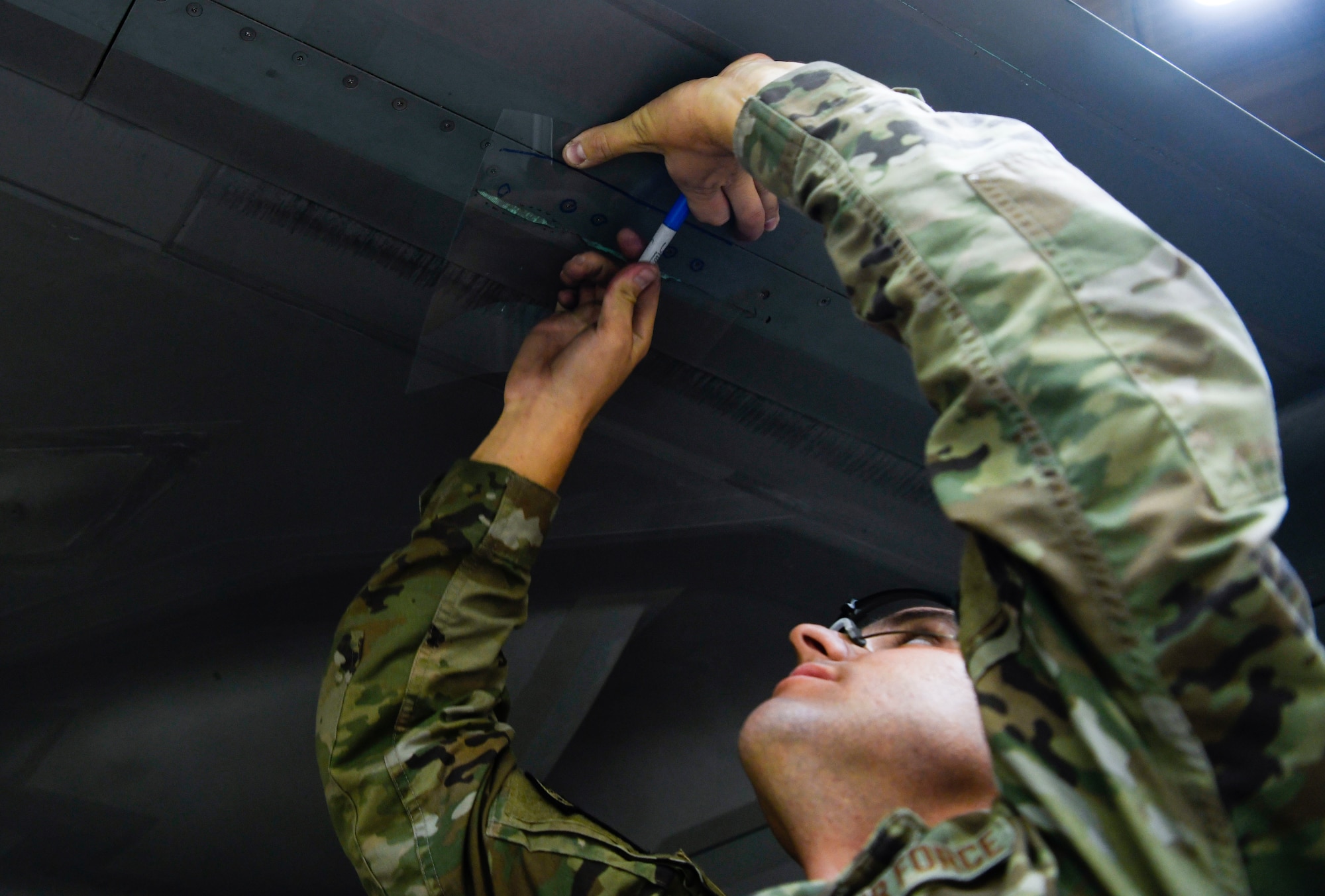 Staff Sgt. Robert Briones, 62nd Aircraft Maintenance Unit crew chief, inspects an F-35A Lightning II aircraft wing June 4, 2021, at Luke Air Force Base, Arizona. Briones trains Airmen from the 61st AMU through the Lightning Technician Program, which consolidates the maintenance career fields for the F-35A. The sharing of information among units through LTP cultivates an environment of excellence throughout the 56th Maintenance Group, helping establish multi-capable Airmen. (U.S. Air Force photo by Airman 1st Class David C. Busby)