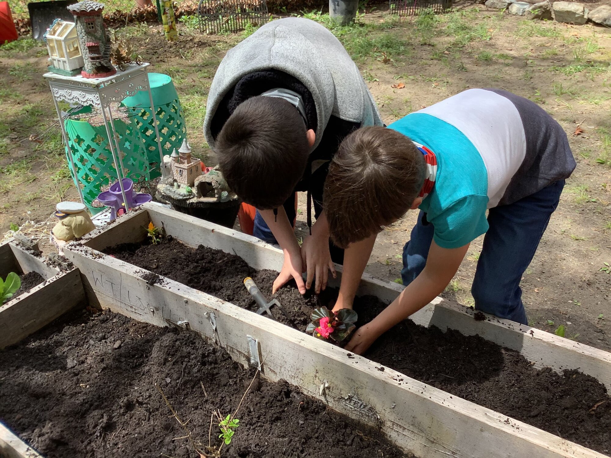 Kids planting flowers