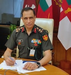 an India Ministry of Defence general officer sits at a desk