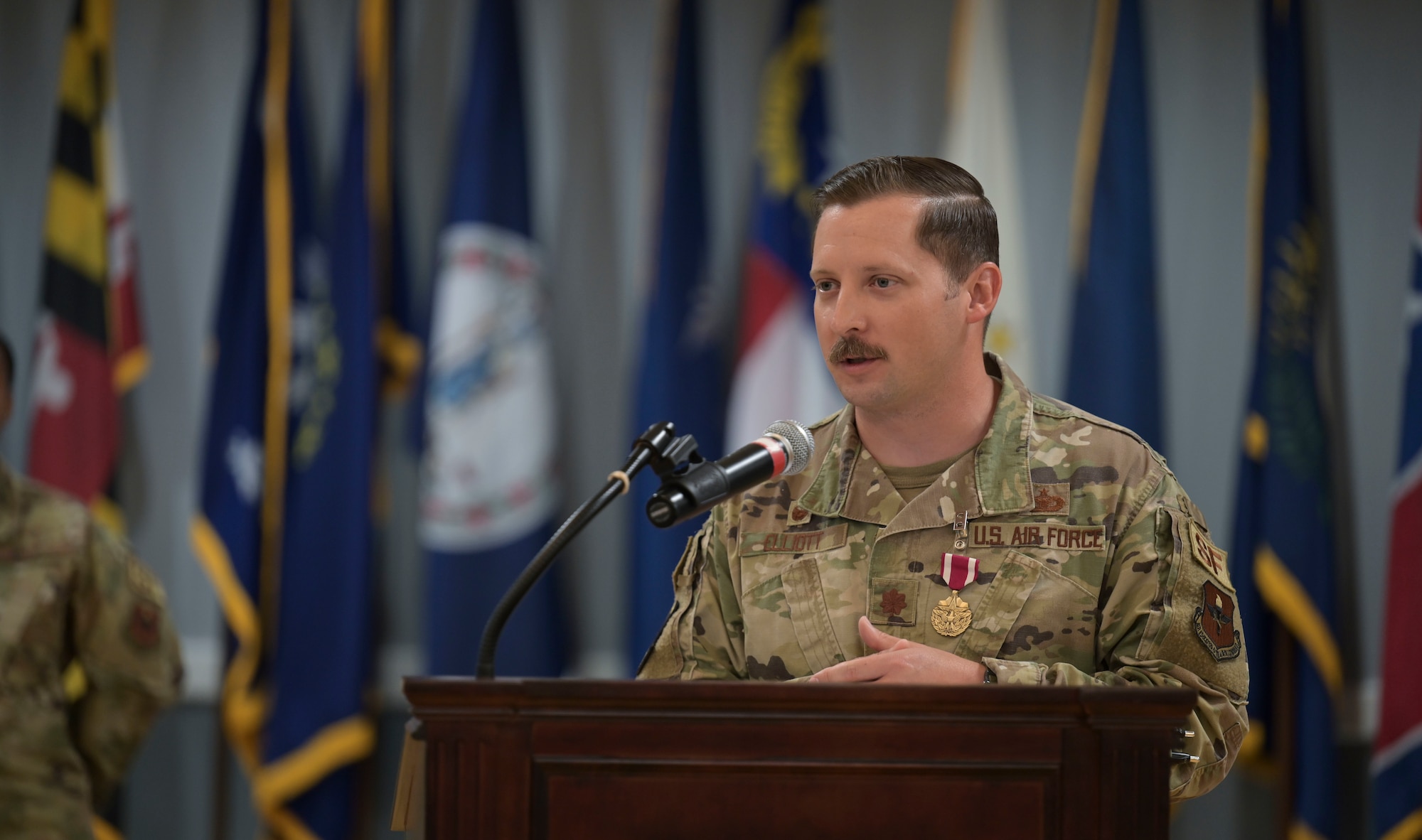 U.S. Air Force Maj. Cody Elliot, outgoing 14th Security Forces Squadron commander, thanks many personnel who has impacted his career as commander during a change of command ceremony, June 11, 2021, on Columbus Air Force Base, Miss. Elliott worked tirelessly to bring advancements to the 14th SFS such as a new armory which resulted in defenders being more proficient during turn-over times.  (U.S. Air Force photo by Airman 1st Class Jessica Haynie)