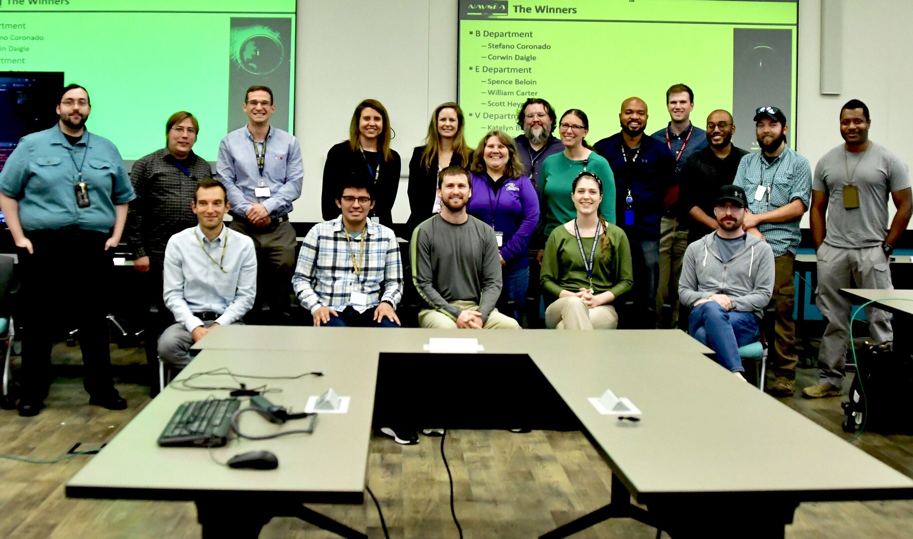 IMAGE: The teams finished up the event with presentations, followed by the hosts awarding the three top teams. Along the back (from left to right) B Department DevOps Lead Corwin Daigle, E36 Department Scientist William Carter, E17 Department Scientist Spencer Beloin, Deputy Chief Technology Officer Karen Smith, Chief Technology Officer Jennifer Clift, Microsoft Technical Strategist Monica DeZulueta, iLab Director Dr. John Rigsby, Deputy iLab Director Tamara Stuart, iLab System Engineer Eric Hayes, V12 Department Software Engineer Devin Drake, H24 Department Software Engineer Israel Johnson, H Department Scientist Ethan Hada and M Department Coder Michael Hurbert. Along the front (from left to right) Analyst for the A department Robert Pullin, B Department Scientist Stefano Coronado, E Department Test Engineer Scott Heyman, V Department Cost Analyst Katelyn Barbre and B35 Department Scientist Ryan Olk.