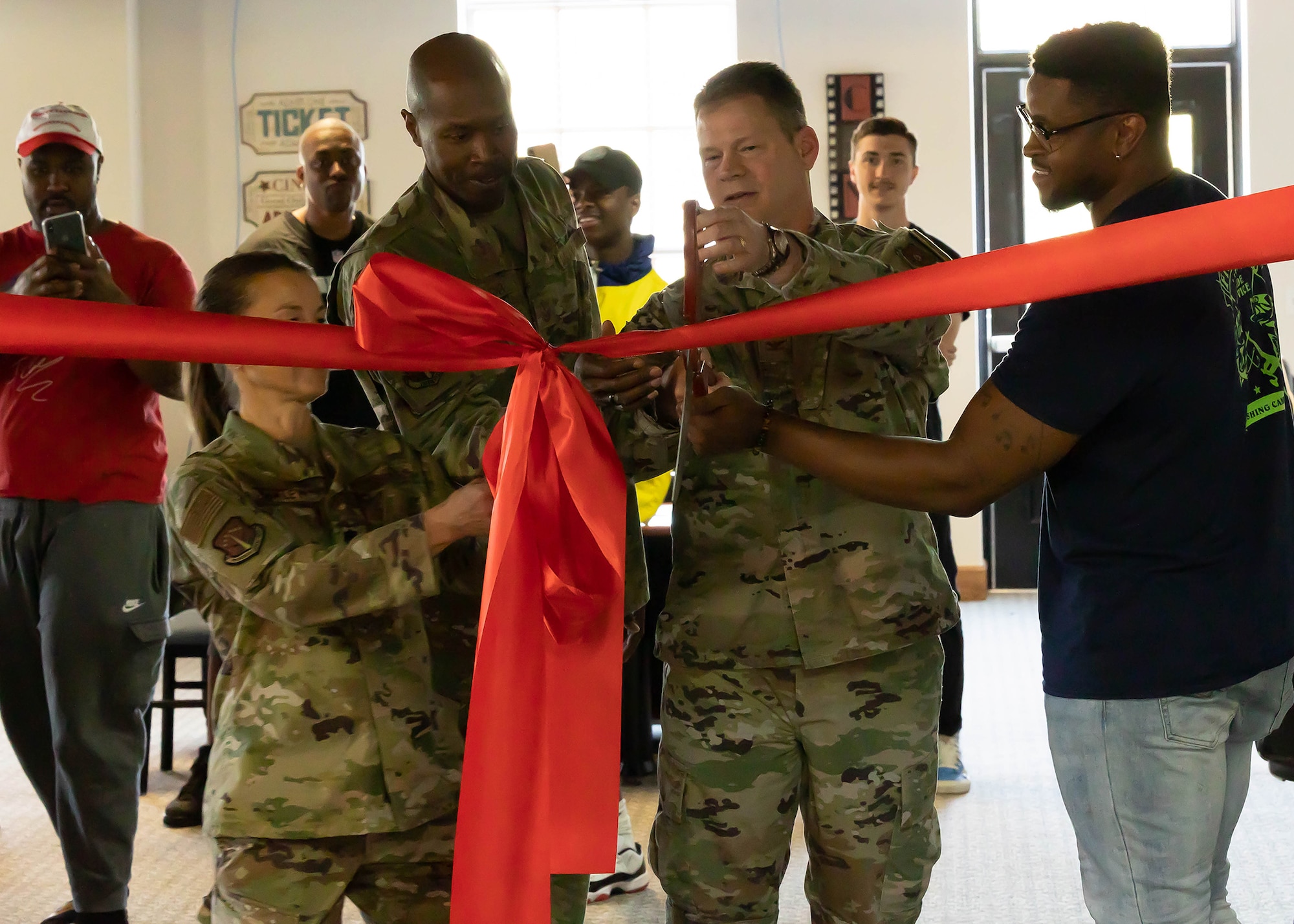 Col. Peter Bonetti, 90th Missile Wing commander and Chief Master Sgt. Nicholas Taylor, 90 MW command chief, conduct a ribbon-cutting ceremony for the Fall Hall Game Capsule June 5, 2021, on F.E. Warren Air Force Base, Wyoming.  The game room was tied to the Air Force Gaming League, allowing Airmen to participate in person or online for our 165 Discord members. The new capsule provides another opportunity for Airmen to maintain resiliency and build connections. (U.S. Air Force photo by Tech. Sgt. Rayshard Carter)