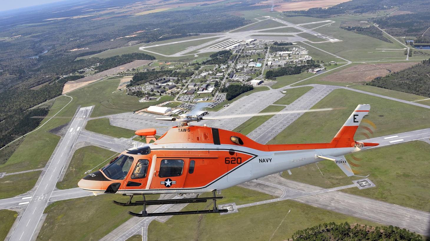 A TH-73 helicopter flies over the Leonardo Helicopters’ manufacturing facility in Philadelphia where it and 129 others will be built.