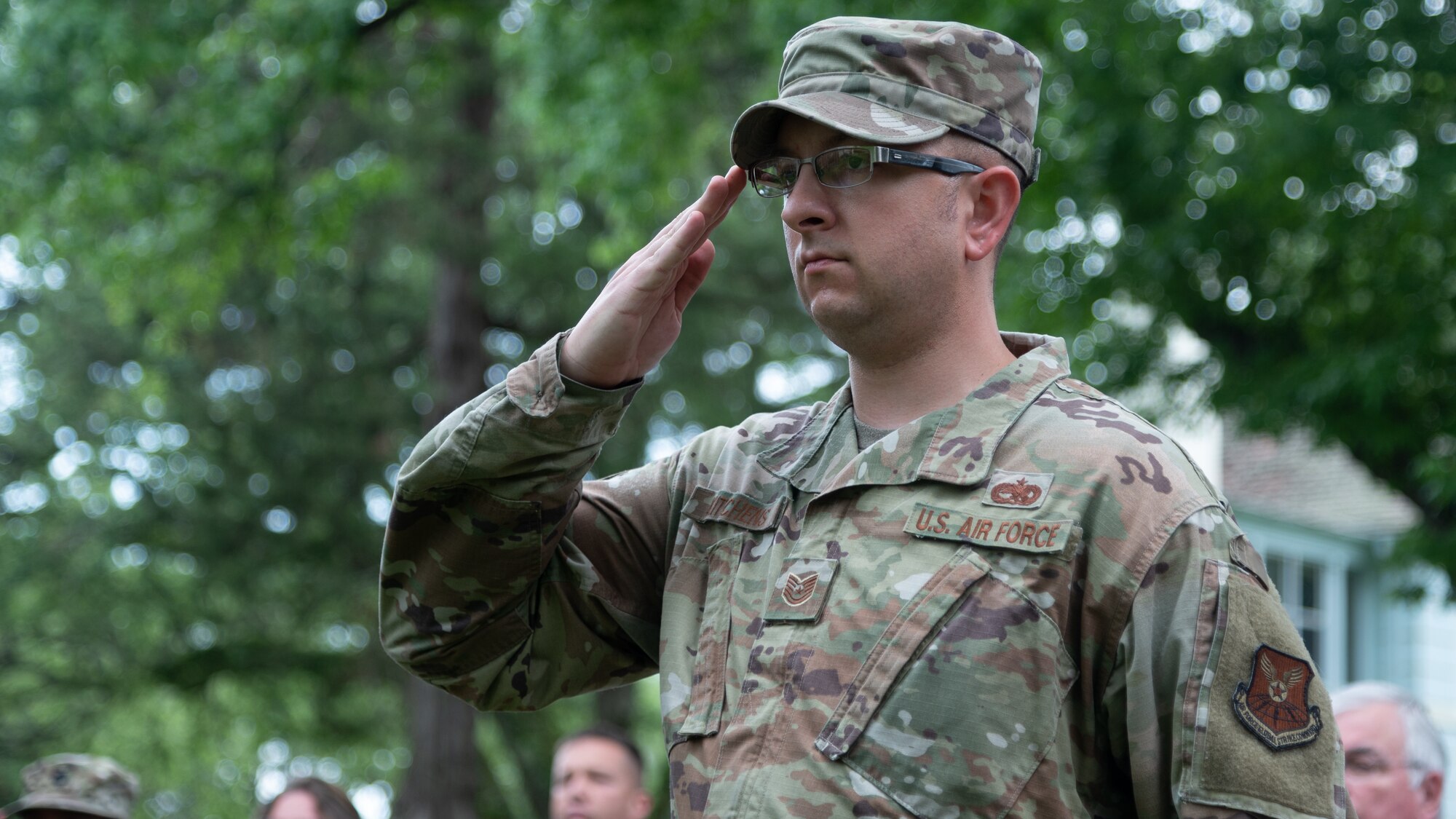 Tech. Sgt. Brandon Kitchens, 2nd Maintenance Squadron NCO in charge of maintenance flight, salutes while the National Anthem plays at Barksdale Air Force Base, June 8, 2021. Kitchens crafted the new Barksdale community book exchange box with materials donated by the Every Warrior Network.