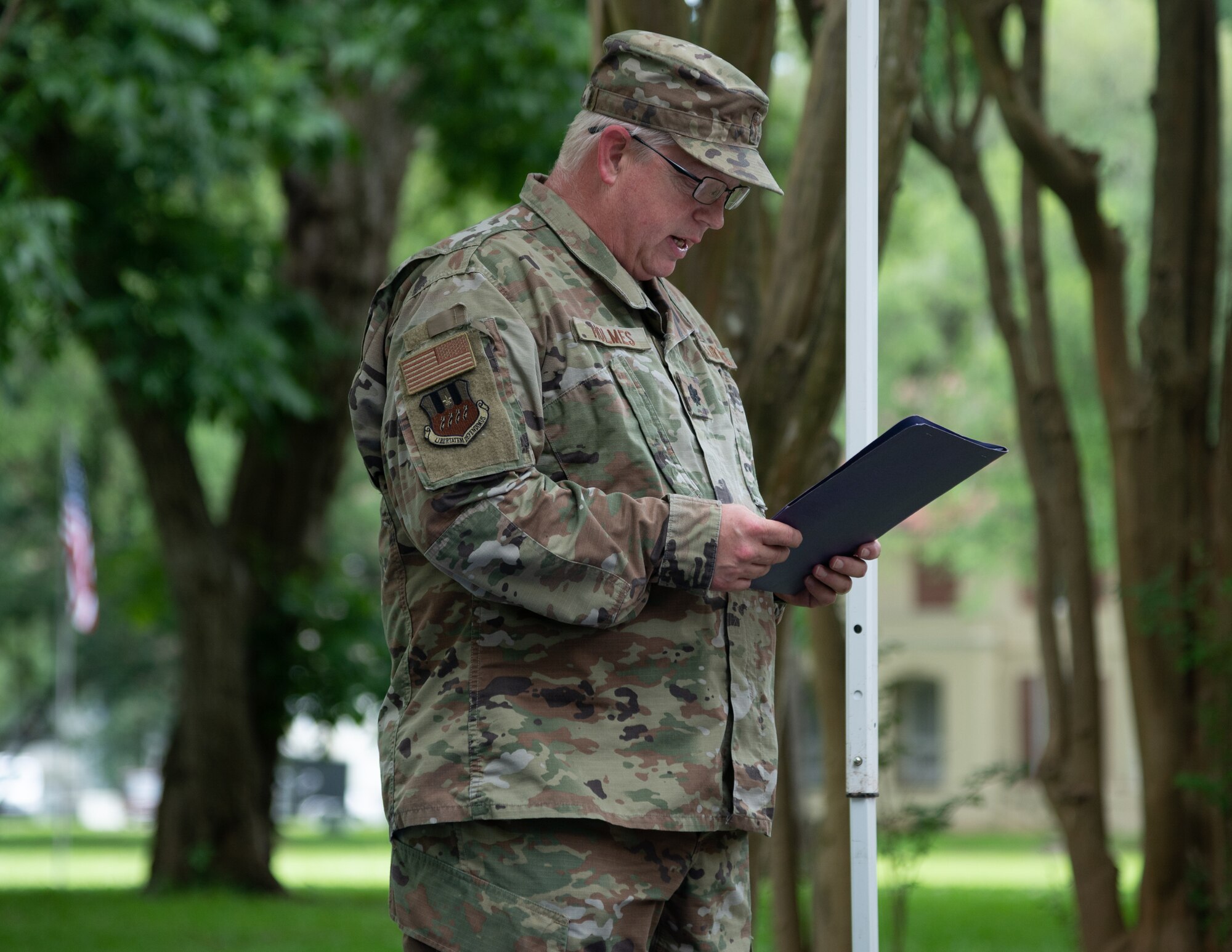Lt. Col. Richard Holmes, 2nd Bomb Wing unit chaplain, delivers the invocation for the new community book exchange box at Barksdale Air Force Base, June 8, 2021. The exchange box is located on Chennault Avenue and is dedicated to honor Lt. Gen. Claire Chennault’s exemplary service.