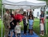 Nell Calloway, president of the Chennault Museum, cuts a ribbon to officially open the new community book exchange box at Barksdale Air Force Base, June 8, 2021. Calloway is the granddaughter of Lt. Gen. Claire Chennault, to whom the book exchange box is dedicated