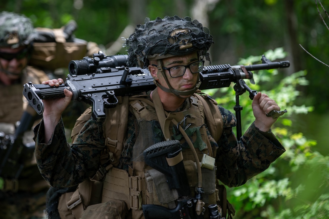 U.S. Marine Corps Pfc. Samson Bevins, a machine gunner with 1st Battalion, 2d Marine Regiment (1/2), 2d Marine Division, patrols through a treeline at Camp Lejeune, N.C., June 10, 2021. In support of Marine Operational Test and Evaluation Squadron 1, Marines with 1/2 executed an air assault operation to test the capabilities of the CH-53K King Stallion, the U.S. Marine Corps’ newest heavy-lift helicopter. (U.S. Marine Corps photo by Lance Cpl. Reine Whitaker)