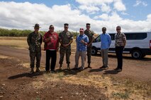 Kurt Fevella, state senator, Hawaii, his staff, and Marine Corps Base Hawaii staff pose for a photo during a visit, June 9, 2021. The purpose of the visit was to brief Fevella and staff on operations aboard the training facility and explain the importance of rifle qualifications for Marine Corps readiness. Base Staff also discussed the proposed shoreline stabilization project and the importance of slowing down coastal erosion. (U.S. Marine Corps photo by Lance Cpl. Samantha Sanchez)