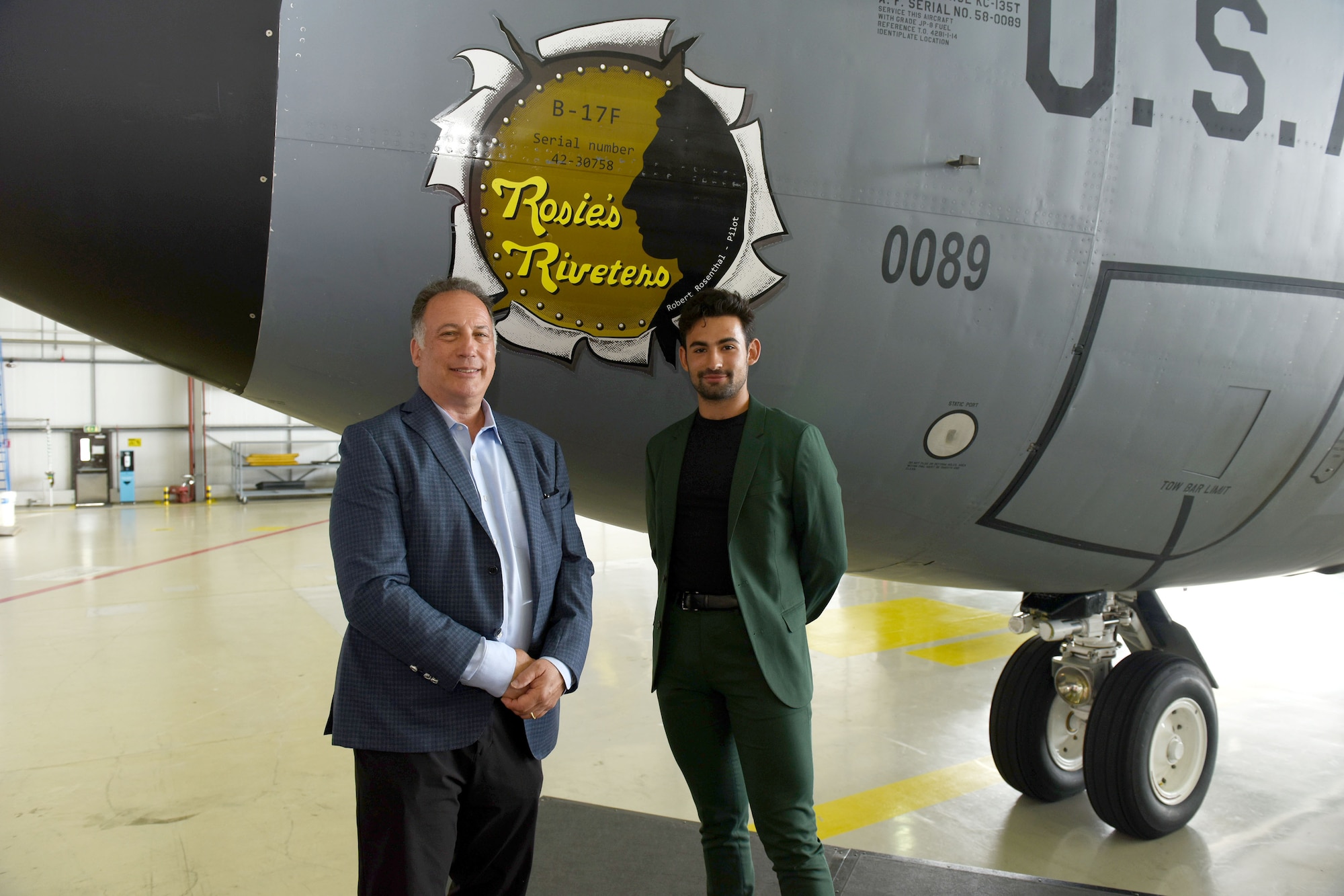 Dan Rosenthal, left, and his son Sam, son and grandson of retired-Lt. Col. Robert “Rosie” Rosenthal, pose for a photo with the 100th Air Refueling Wing’s newest heritage nose art, “Rosie’s Riveters” during an unveiling ceremony at Royal Air Force Mildenhall, England, June 10, 2021. The nose art was dedicated to Rosie, former 418th Bomb Squadron, 100th Bombardment Group, pilot and aircraft commander during World War II. He passed away in 2007 aged 89, but Dan and Sam attended the dedication ceremony in his honor. The jet, tail number 58-0089, was also “adopted” by the 100th Maintenance Group as part of RAF Mildenhall’s “Adopt-a-Jet” program. (U.S. Air Force photo by Karen Abeyasekere)