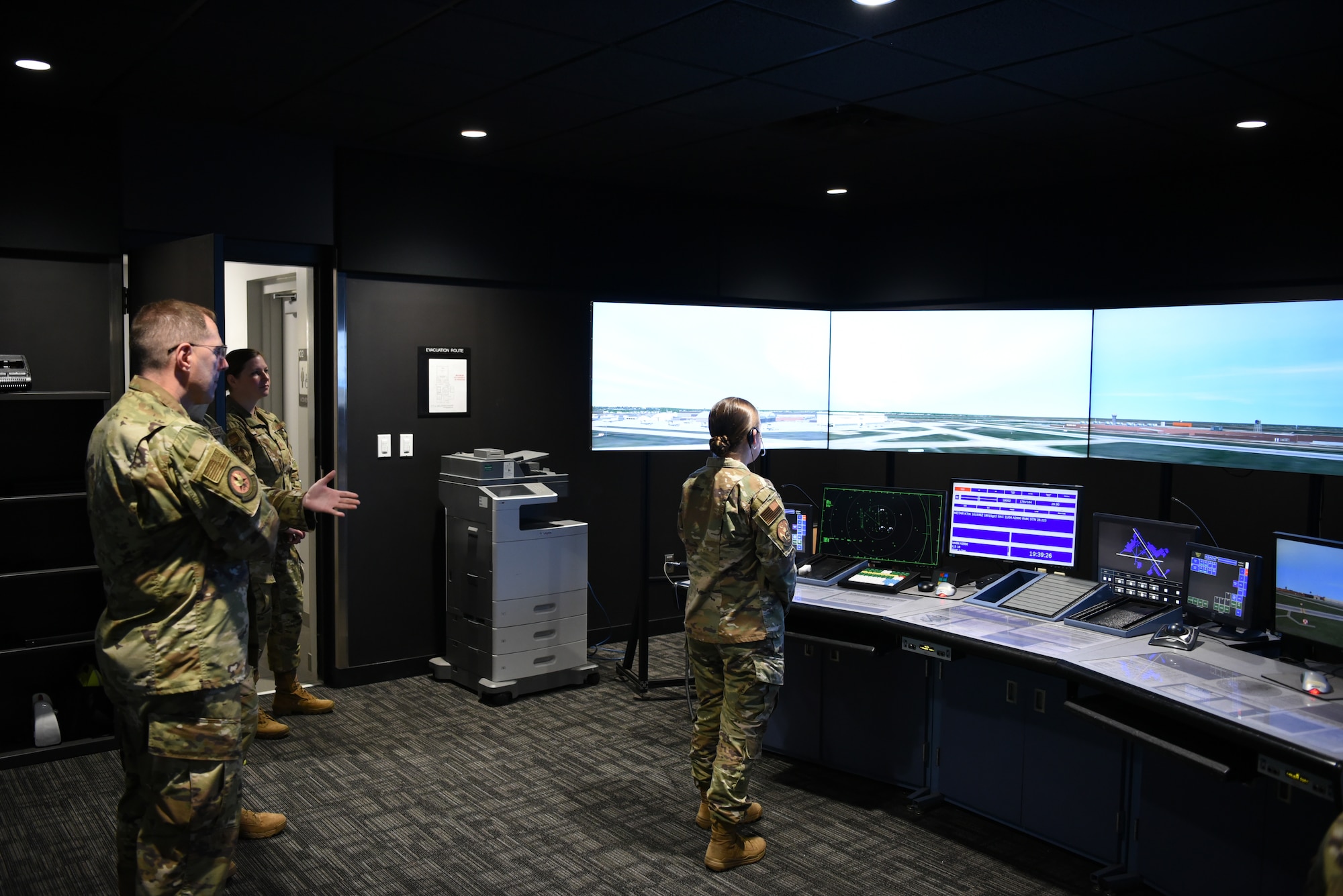 Female Airman using air traffic control simulator