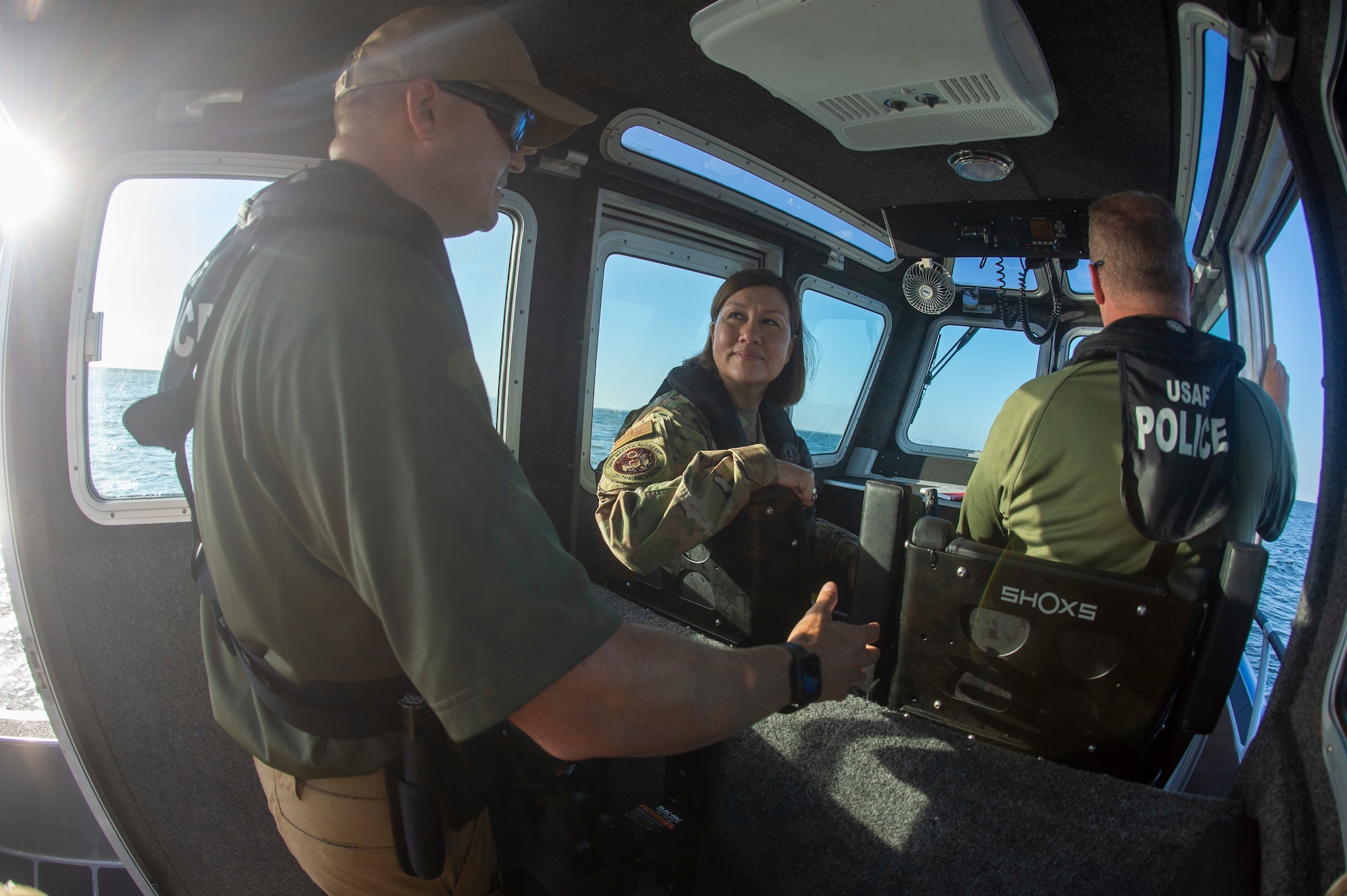 Chief Master Sgt. of the Air Force JoAnne S. Bass discusses safety protocols with members of the 6th Security Forces Squadron at MacDill Air Force Base, June 10, 2021.