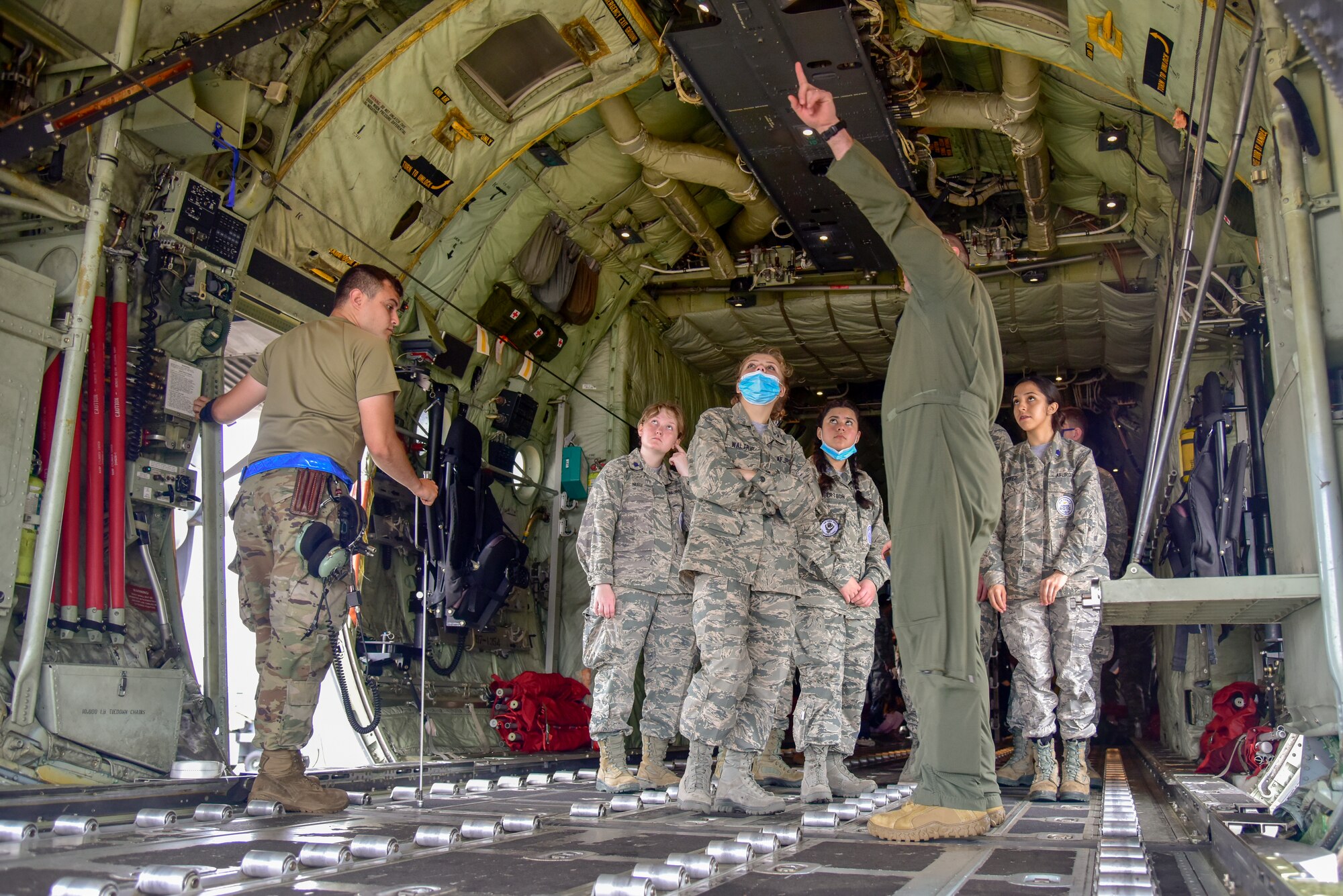 Junior ROTC cadets tour an aircraft.