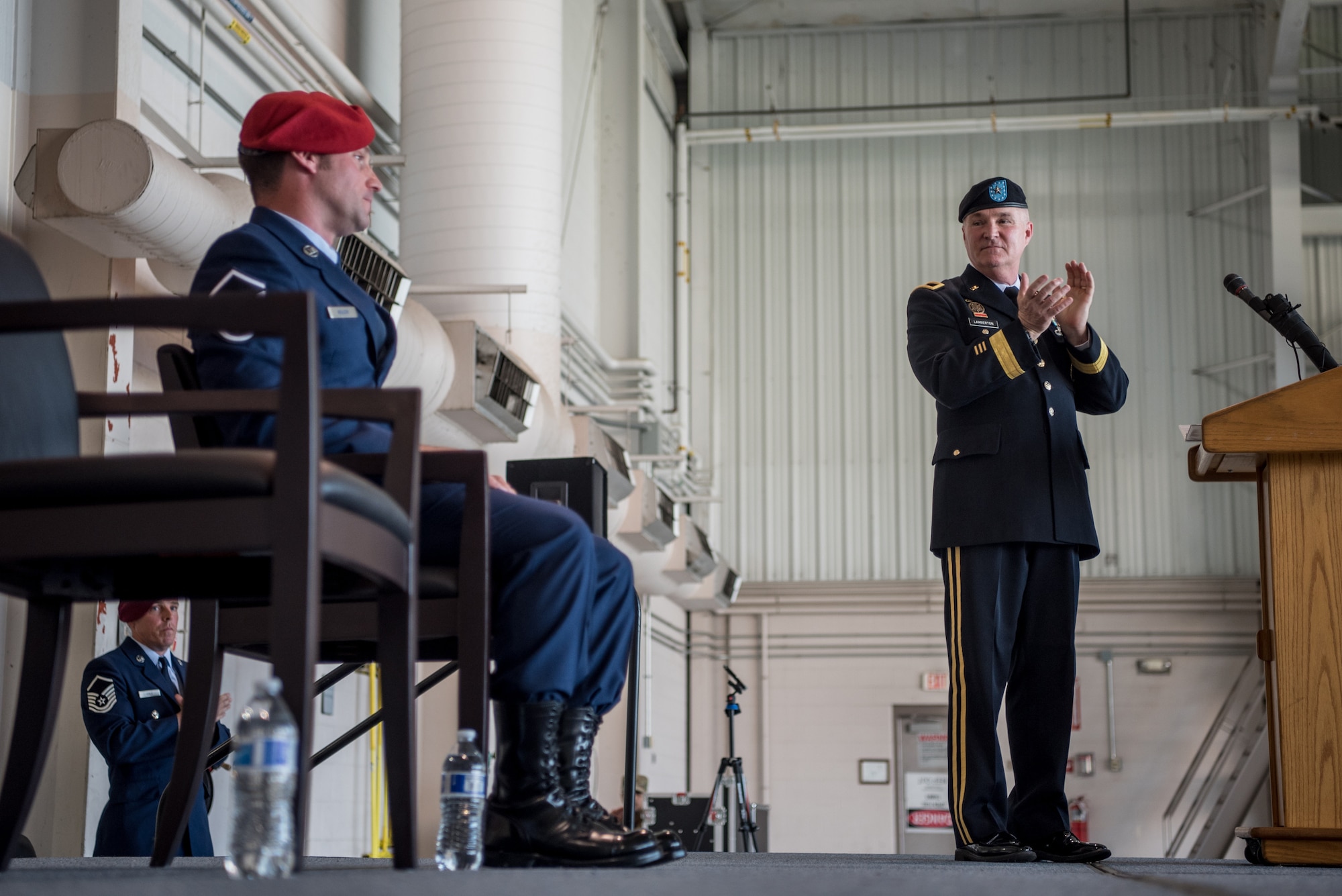 Brig. Gen. Hal Lamberton (right), applauds Master Sgt. Daniel Keller (left), a combat controller in the 123rd Special Tactics Squadron, during an Airman’s Medal award ceremony at the Kentucky Air National Guard Base in Louisville, Ky., June 12, 2021. Keller earned the award for heroism in recognition of his actions to save human life following a traffic accident near Louisville in 2018. (U.S. Air National Guard photo by Tech. Sgt. Joshua Horton)
