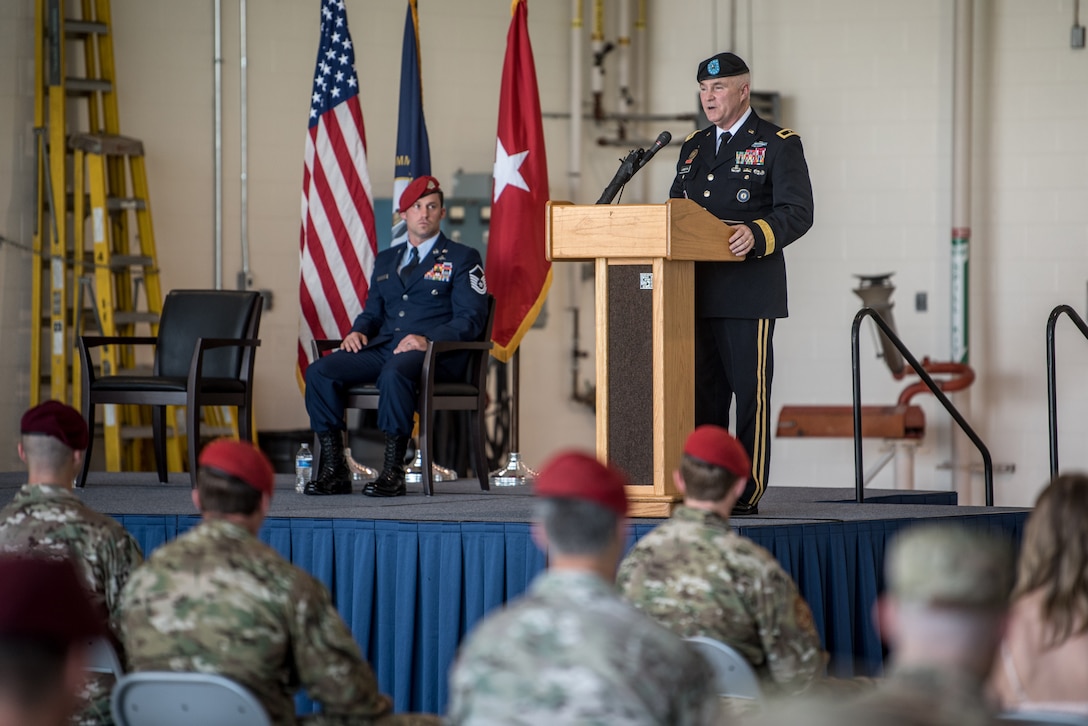 Brig. Gen. Hal Lamberton, the adjutant general for the Commonwealth of Kentucky, speaks at a ceremony commemorating the presentation of the Airman’s Medal to Master Sgt. Daniel Keller, a combat controller in the 123rd Special Tactics Squadron, at the Kentucky Air National Guard Base in Louisville, Ky., June 12, 2021. Keller earned the award for heroism in recognition of his actions to save human life following a traffic accident near Louisville in 2018. (U.S. Air National Guard photo by Tech. Sgt. Joshua Horton)