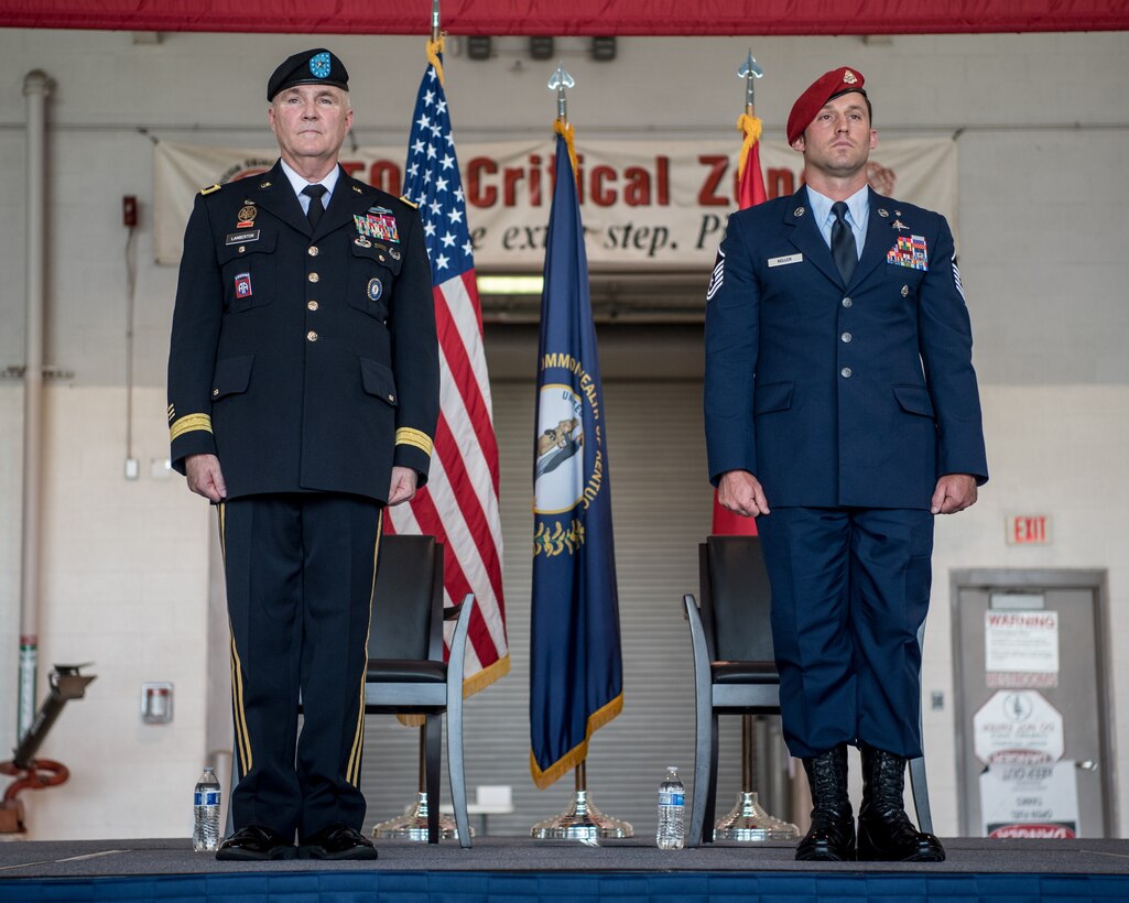 Master Sgt. Daniel Keller (right), a combat controller in the 123rd Special Tactics Squadron, prepares to receive the Airman’s Medal from Brig. Gen. Hal Lamberton, the adjutant general for the Commonwealth of Kentucky, during a ceremony at the Kentucky Air National Guard Base in Louisville, Ky., June 12, 2021. Keller earned the award for heroism in recognition of his actions to save human life following a traffic accident near Louisville in 2018. (U.S. Air National Guard photo by Tech. Sgt. Joshua Horton)